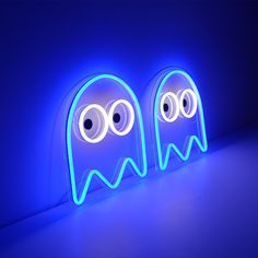 two neon lights that look like ghost faces