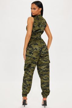 Available In Green/combo. Jumpsuit Sleeveless Mock Neck Zip Front Cargo Pockets Jogger Non Stretch Disclaimer Print Placement May Vary 100% Polyester Imported | Hidden in Plain Sight Camo Jumpsuit in Green size 1X by Fashion Nova Camouflage Jumpsuits And Rompers For Summer, Fitted Camouflage Casual Jumpsuit, Sleeveless Camouflage Jumpsuits And Rompers For Summer, Casual Camouflage Sleeveless Jumpsuits And Rompers, Camo Jumpsuit, Hidden In Plain Sight, Sleeveless Mock Neck, Green Jumpsuit, Promotional Events