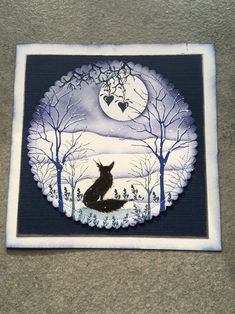 a painting of a fox sitting in the middle of a forest at night with a full moon behind it