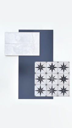 two pieces of paper with black and white stars on them, one is folded over the other