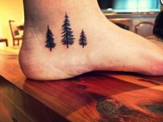 small pine tree tattoo on the foot