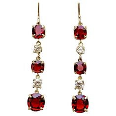 Ultra fine unheated Burma Red Spinel and Diamond Drop Earrings in 18K Yellow Gold. The cushion cut red spinel pair on bottom weigh a total of 3.02 carats and the four antique cushion cut spinel on the top weigh a total of 3.05 carats. The four round cut diamonds weigh a total 0.72 carats, G-H in color and VS in clarity. These magnificent earrings are 2 inch in length. Total Gemstone Weight: 6.79 carats Notice that all items manufactured by us can be customized or redesigned. Luxury Red Ruby Earrings, Luxury Red Earrings For Formal Occasions, Luxury Red Gemstone Earrings, Classic Red Ruby Earrings, Classic Ruby Red Earrings, Red Prong-set Earrings For Formal Occasions, Formal Red Ruby Earrings, Formal Red Earrings With Prong Setting, Red Hallmarked Evening Jewelry