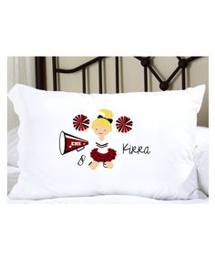 a pillow that has a girl with a cheerleader on it