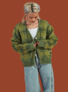 *This item is excluded from the VIP30 promotion Fuzzy, over-sized, supersoft plaid cardigan with a boxy fit. Features include two front pockets, dropped shoulders, elongated sleeves and a UNIF flag tag at the bottom of pocket seam. Just a reminder. It fits over-sized just like it's supposed to. Model is 5'4" and wearing a size S. 100% Acrylic Imported SKU: UWC-1022 Unif Ty Cardigan, Ty Cardigan, Cardigan Outfit Aesthetic, Flag Tag, Plaid Cardigan, Green Cardigan, Cardigan Outfits, Just A Reminder, Knitwear Design