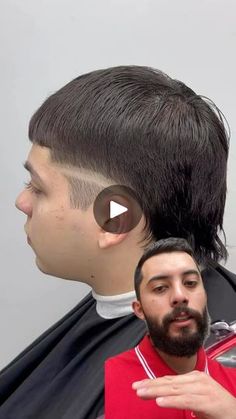 a man in a barbershop has his hair cut and is talking to someone