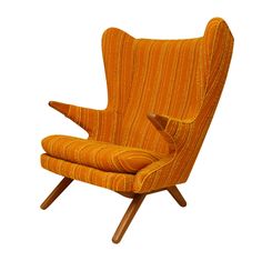 an orange striped chair with wooden legs