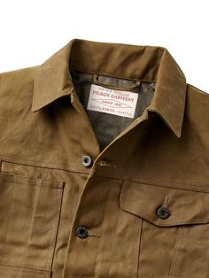 Often imitated, never equaled. The Filson Short Lined Cruiser is made with Tin Cloth, Filson's signature waxed cotton that outperforms and outlasts the competition. Since the 1920s, it has protected foresters and outdoorsmen from brambles and abrasion in the rain-soaked forests of the Pacific Northwest. No other waxed canvas matches its durability, weather resistance, or legacy of protection. Filson's oil-finish Tin Cloth comes from British Millerain, pioneers of waxing cotton. At 14 oz. per squ Book Clothes, Dark Tan, Wet Weather, Work Jackets, Line Jackets, Waxed Cotton, Short Jumpsuit, We Wear, Mens Denim