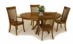 a wooden table with four chairs and a potted plant on top of the table