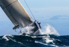 a sailboat is in the middle of an ocean wave