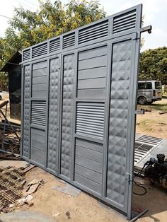 an outdoor storage area with several doors on the side