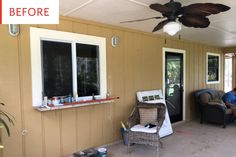 a man sitting in a chair on top of a porch next to a window and ceiling fan