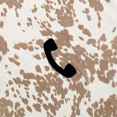 an old phone is on the wall with brown spots