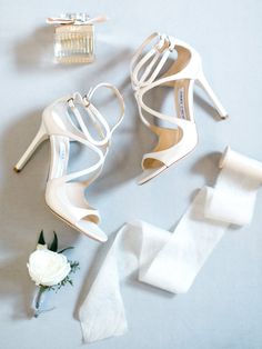 the bride's shoes and accessories are laid out on the table