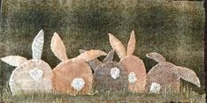 an image of some rabbits in the grass