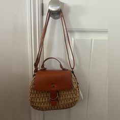 Nwt Camel Brown Leather And Raffia Top Handle Bag - Small Pocket On The Interior Versatile Bag That Can Be Carried By The Top Handle Or As A Shoulder Bag Perfect For Beach And Destination Vacations Casual Double Handle Satchel With Hasp Closure, Casual Shoulder Bag With Hasp Closure And Double Handle, Casual Crossbody Bags With Hasp Closure, Light Brown Shoulder Bag For Spring Travel, Spring Travel Light Brown Shoulder Bag, Casual Light Brown Shoulder Bag For Spring, Casual Satchel With Detachable Strap And Top Handle, Trendy Brown Straw Crossbody Bag, Spring Light Brown Shoulder Bag For Daily Use