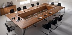 a large conference table with chairs around it