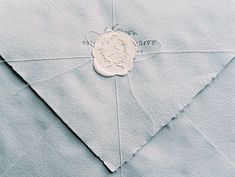 an envelope with a wax stamp on it