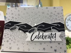 congratulations card with graduation caps and stars on it