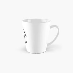 a tall white mug with black writing on the inside and bottom, in front of a white background