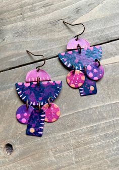 Copper Chandelier Earrings.  These earrings are formed from solid copper, and finished with a mix of pink, purple, navy and coral hand painted detail.  Each pair of earrings are one of a kind, please allow some slight variances in design and color.   Dimensions: 1.25 W, 2.25 L Pink Hand Painted Dangle Jewelry, Pink Hand Painted Dangle Earrings, Artistic Pink Dangle Earrings, Artsy Purple Dangle Earrings, Pink Artsy Drop Earrings, Artsy Pink Jewelry With Matching Earrings, Artsy Hand Painted Pink Jewelry, Artsy Hand-painted Pink Jewelry, Hand Painted Earrings