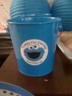 two blue buckets sitting on top of a table