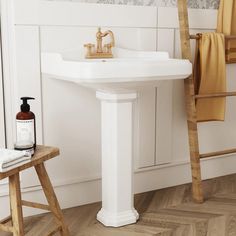 a white sink sitting next to a wooden ladder in a bathroom on top of a hard wood floor