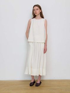 Composition : RAYON85 NYLON15Country of Origin : Republic of Korea Feminine Cream Sleeveless Blouse, Feminine Sleeveless Cream Blouse, Chic Off-white Sleeveless Blouse, Cream Sleeveless Cotton Blouse, Cream Sleeveless Top For Daywear, Feminine Sleeveless Off White Top, Off White Sleeveless Top For Spring, Off White Sleeveless Summer Blouse, Cream Sleeveless Blouse For Day Out