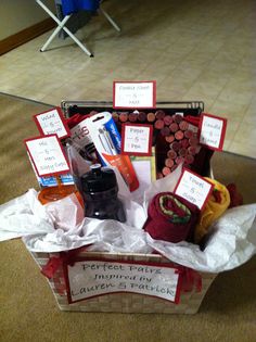 a basket filled with different types of condiments and sauces on the floor