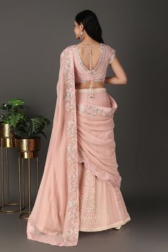 Pink pre-draped lucknowi lehenga saree with floral cutwork embroidery. Paired with a floral embroidered padded blouse and petticoat with attached cancan. - Aza Fashions Traditional Drape Pre-draped Saree For Wedding And Navratri, Draped Lehenga In Georgette With Zari Work, Draped Georgette Lehenga With Zari Work, Festive Draped Lehenga In Georgette, Festive Draped Georgette Lehenga, Georgette Draped Traditional Wear For Wedding, Draped Georgette Traditional Wear For Wedding, Draped Georgette Designer Lehenga, Reception Choli With Sheer Dupatta In Traditional Drape