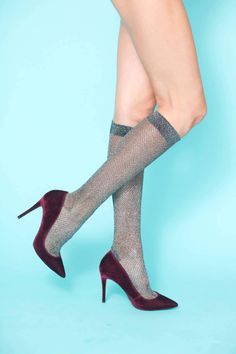 Featuring a timeless herringbone design in a sophisticated gunmetal metallic design with a wide elasticated band to prevent them slipping that can be styled a variety of ways- slouchy around the calf or pulled up at the knee. These socks are an instant fashion game-changer and can be effortlessly paired with booties, boots, heels or flats. Wear them with skirts, dresses or peeking out under jeans or pants. – 80% Chinlon, 20% Spandex – Hand wash – One size, comfortably fits a US size 5-10 / EU si Metallic Socks, Lauren Lane, Pilates Workout Routine, Boot Camp Workout, Metallic Design, Diva Boutique, Gym Workout Outfits, Herringbone Design, Barre Workout