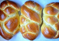 four loaves of bread sitting next to each other