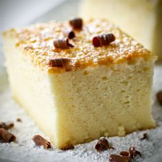 two pieces of cake sitting on top of a white plate