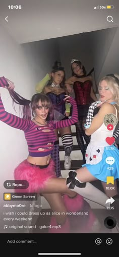 several women dressed up in costumes posing for a photo on their cell phone with the caption,