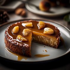 a piece of cheesecake on a plate with caramel topping