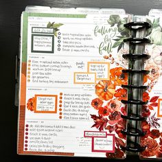 an open planner book with flowers on it