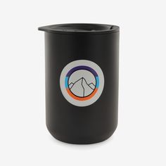 a black cup with a mountain logo on it