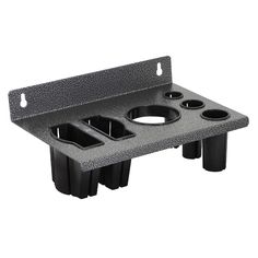 a black plastic cup holder with three cups on it's sides and two holes in the middle