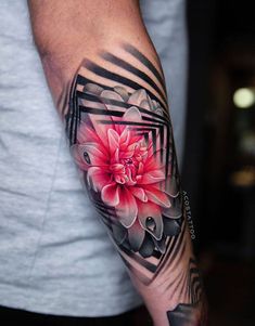 a man's arm with a flower on it and an abstract frame in the middle