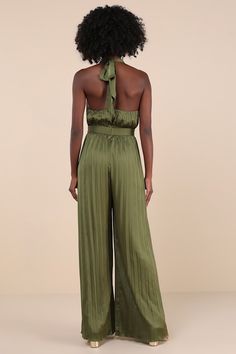 Leave everyone awestruck with the way you strut in the Lulus Confident Impression Olive Green Satin Pleated Halter Jumpsuit! Ultra-sleek, pleated satin shapes this impressive jumpsuit that features a tying halter neckline with a crisscrossing bodice that creates a flirty keyhole detail. Banded, fitted waist sits atop relaxed, wide pant legs that fall to ankle-length hems. Turn around to reveal a sexy open back design. Hidden back zipper/clasp. Fit: This garment fits true to size. Length: Floor length. Size medium measures 61" from top to bottom. Bust: Great for any cup size. Waist: Fitted - very fitted at natural waist. Hip: Not Fitted - room for hips. Undergarments: May be worn with an adhesive bra, petals, or no bra. Fabric: Fabric has no stretch. Lined. Shell: 95% Polyester, 5% Spandex. Sleeveless Pleated Party Jumpsuits And Rompers, Elegant Fitted Pleated Jumpsuits And Rompers, Pleated Fitted Jumpsuits And Rompers For Party, Elegant Sleeveless Pleated Jumpsuits And Rompers, Elegant Sleeveless Pleated Jumpsuit And Romper, Elegant Pleated Jumpsuits And Rompers For Party, Chic Pleated Evening Jumpsuits And Rompers, Chic Pleated Jumpsuits And Rompers For Evening, Elegant Green Strapless Jumpsuit