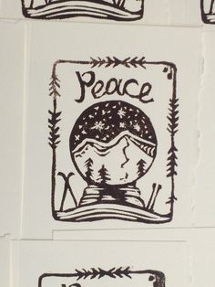 some stickers on the side of a wall that say peace and snowflakes