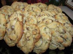 a pile of cookies sitting on top of a black plate