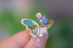 "Introducing our stunning Aquamarine Butterfly Ring - the perfect anniversary gift for that special someone or a lovely treat for yourself. 🦋💍 100% High-quality Natural Aquamarine Gemstones  💎100% High-quality Natural Diamonds 💎  ----------------------♡-------------------- Ring Setting: ●Main stone: 1.0 ct Natural Aquamarine Gemstone ●Material: 18k Gold ●Free Jewelry Certification: A globally recognized certification will come with this fine gem jewelry ●Packaging: All items are nicely packaged ready to gift in elegant jewelry boxes ----------------------♡-------------------- Important Note: ●Since every piece of jewelry is unique and made-to-order for you, the sizes of stones and metal weights may vary slightly. ----------------------♡-------------------- Processing & Free Shipping: ● Luxury Enamel Gemstone Ring For Gift, Luxury Butterfly Ring With Gemstone For Wedding, Elegant Blue Enamel Ring With Gemstone, Enamel Gemstone Rings For Wedding, Blue Enamel Ring With Polished Finish As Gift, Blue Enamel Ring With Polished Finish For Gift, Wedding Rings With Gemstone And Enamel, Luxury Gemstone Butterfly Ring As Gift, Luxury Gemstone Butterfly Ring For Gift