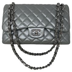 Chanel Silver Metallic Jumbo Double Flap Bag. Excellent condition. Unique silver lambskin leather bag. Silver hardware. Classic style bag with rare silver leather. Collector's piece. Includes dust cover and box. Guaranteed authentic. Chanel Quilted Bag, Handbag Cakes, Hermes Birkin Handbags, Birkin Handbags, Handbag Storage, Wedding Handbag, Work Handbag, Handbag Essentials, Silver Bags