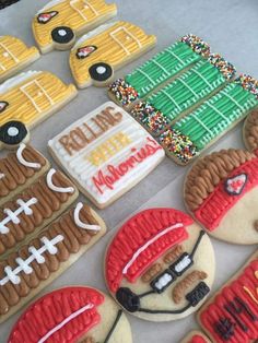 decorated cookies are arranged in the shape of football players