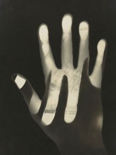 a black and white photo of a person's hand