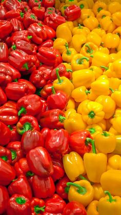 many different types of peppers are stacked up in the same color and size, including yellow or red