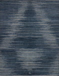 a blue rug with wavy lines on it