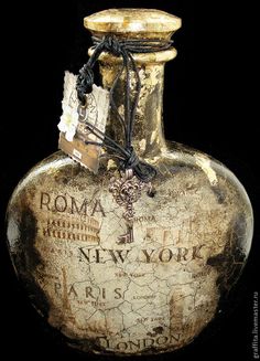 an old bottle with some tags attached to it's top and the words roma new york written on it