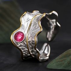 Embrace the elegance of peonies and the allure of tourmaline stones, and let our Sterling Silver and Gold Peony Leaf Ring become a treasured adornment in your jewelry collection. Wear it with pride, knowing that you carry a symbol of grace, prosperity, and the enduring beauty of these precious gems with you wherever you go. It's time to let your style bloom with sophistication and immerse yourself in the captivating allure of these cherished floral wonders. Shape\pattern: Round Setting Type: Bez Peony Leaf, Leaf Rings, Silver Leaf Ring, Tourmaline Stone, Leaf Ring, Tourmaline Ring, Handmade Rings, Fine Jewelry Designers, Tourmaline Gemstone