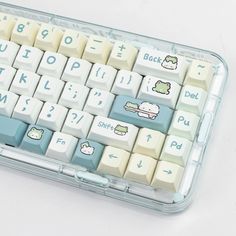 an image of a computer keyboard with hello kitty keys